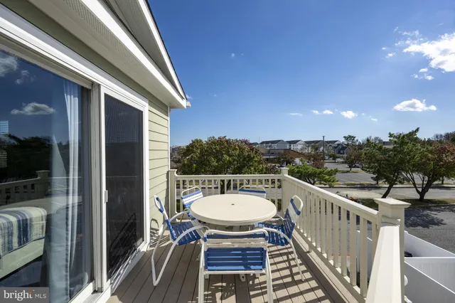 a view of a balcony with furniture