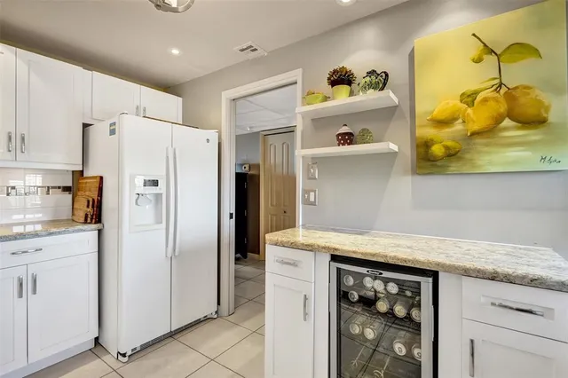 a kitchen with a cabinets and window