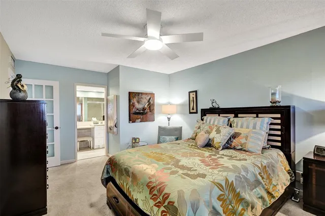 a bedroom with a bed and a view of bedroom