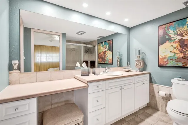 a bathroom with a toilet a sink and a shower