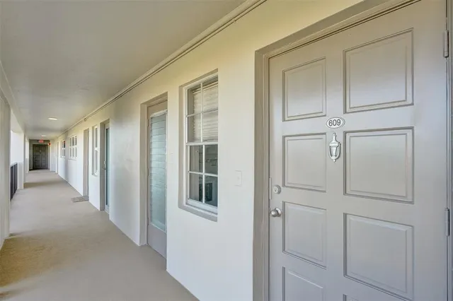 a view of a building with potted plants