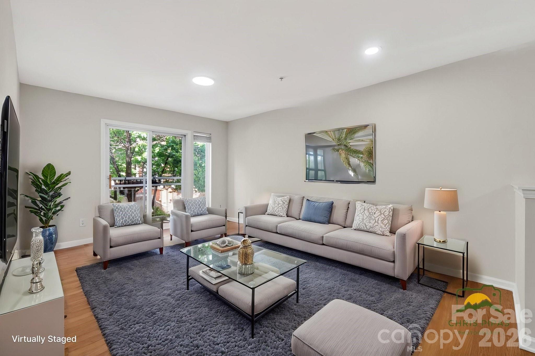 639 Raphael Place Charlotte, NC 28205 - Photo 11 of 36 a living room with furniture potted plant and a window