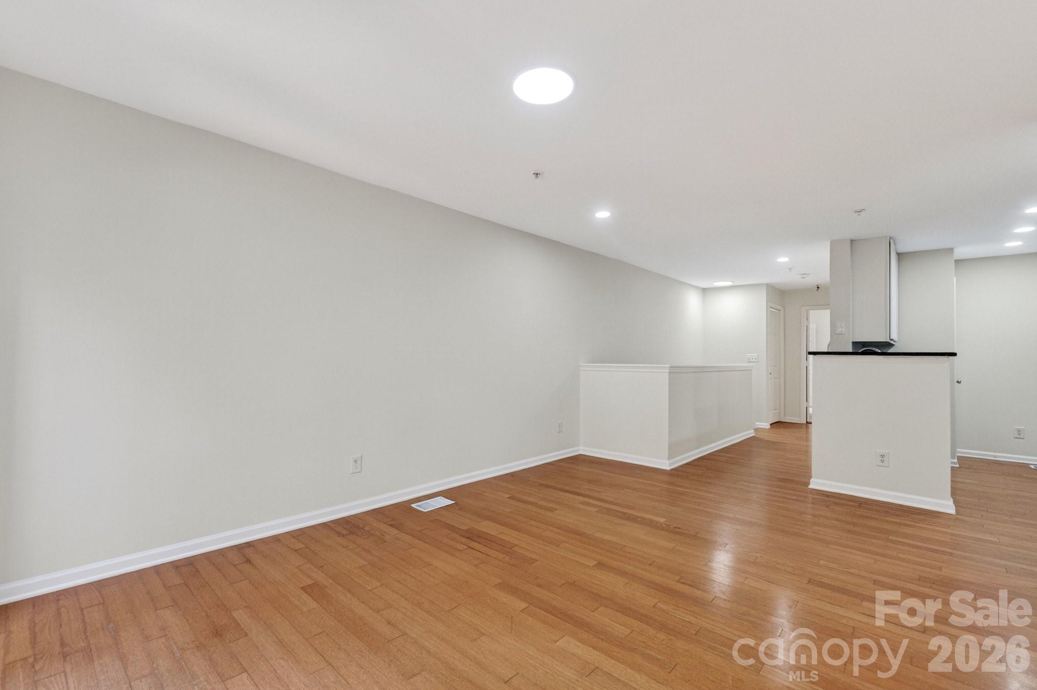 639 Raphael Place Charlotte, NC 28205 - Photo 16 of 36 a view of empty room with wooden floor