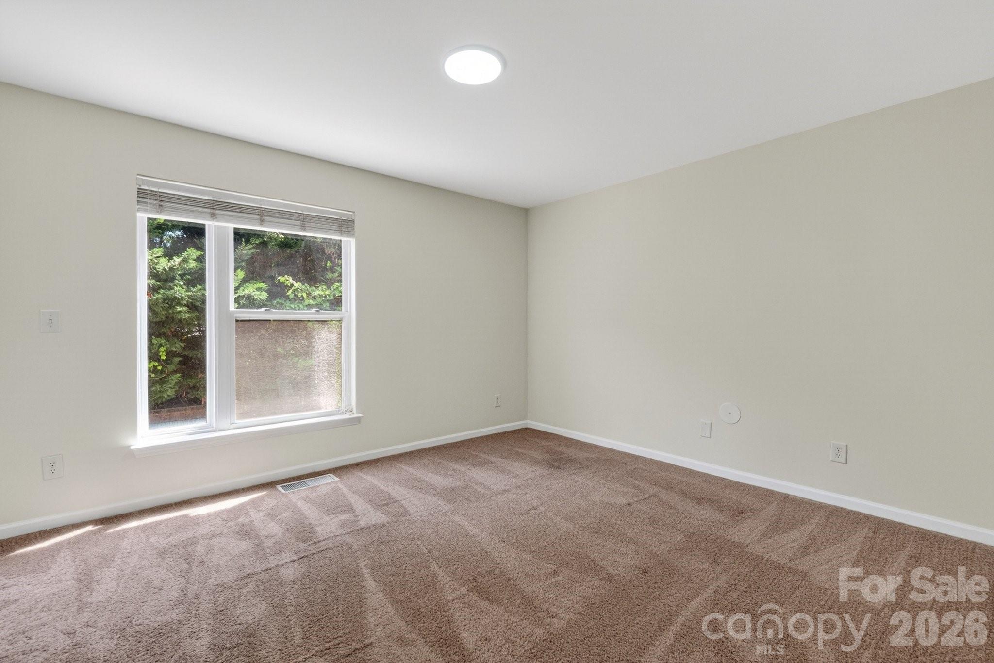 639 Raphael Place Charlotte, NC 28205 - Photo 17 of 36 an empty room with a window
