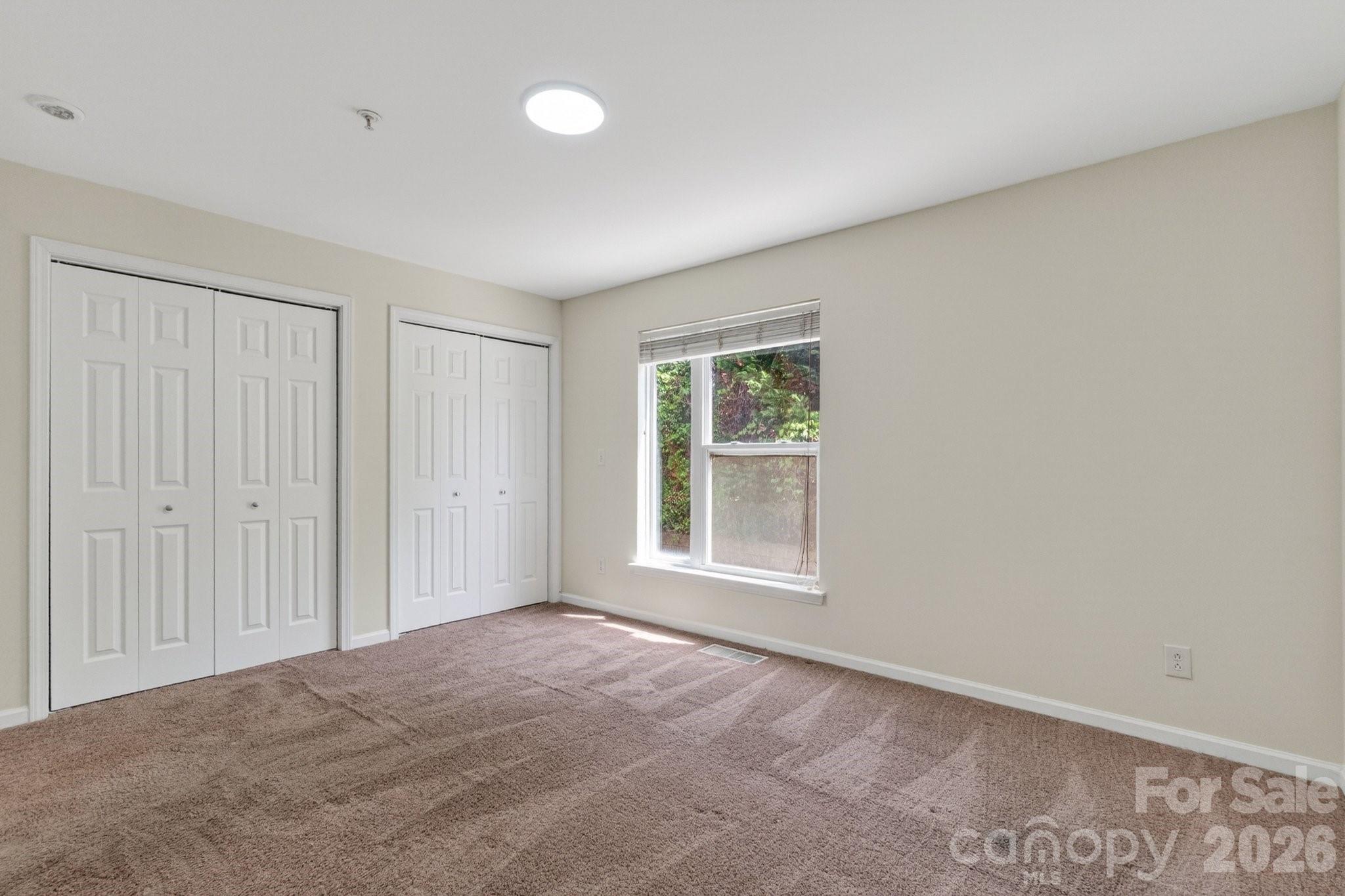 639 Raphael Place Charlotte, NC 28205 - Photo 19 of 36 an empty room with windows