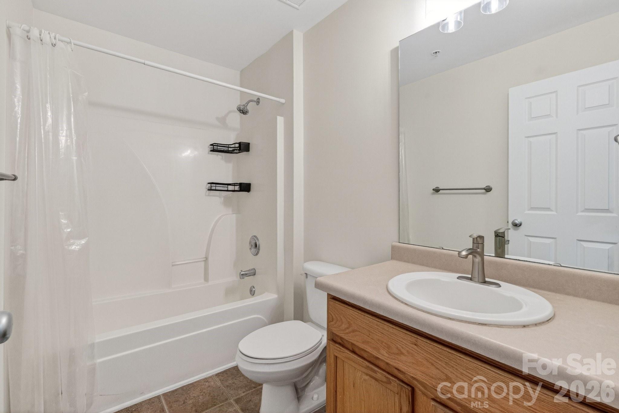 639 Raphael Place Charlotte, NC 28205 - Photo 21 of 36 a bathroom with a sink toilet and a bathtub