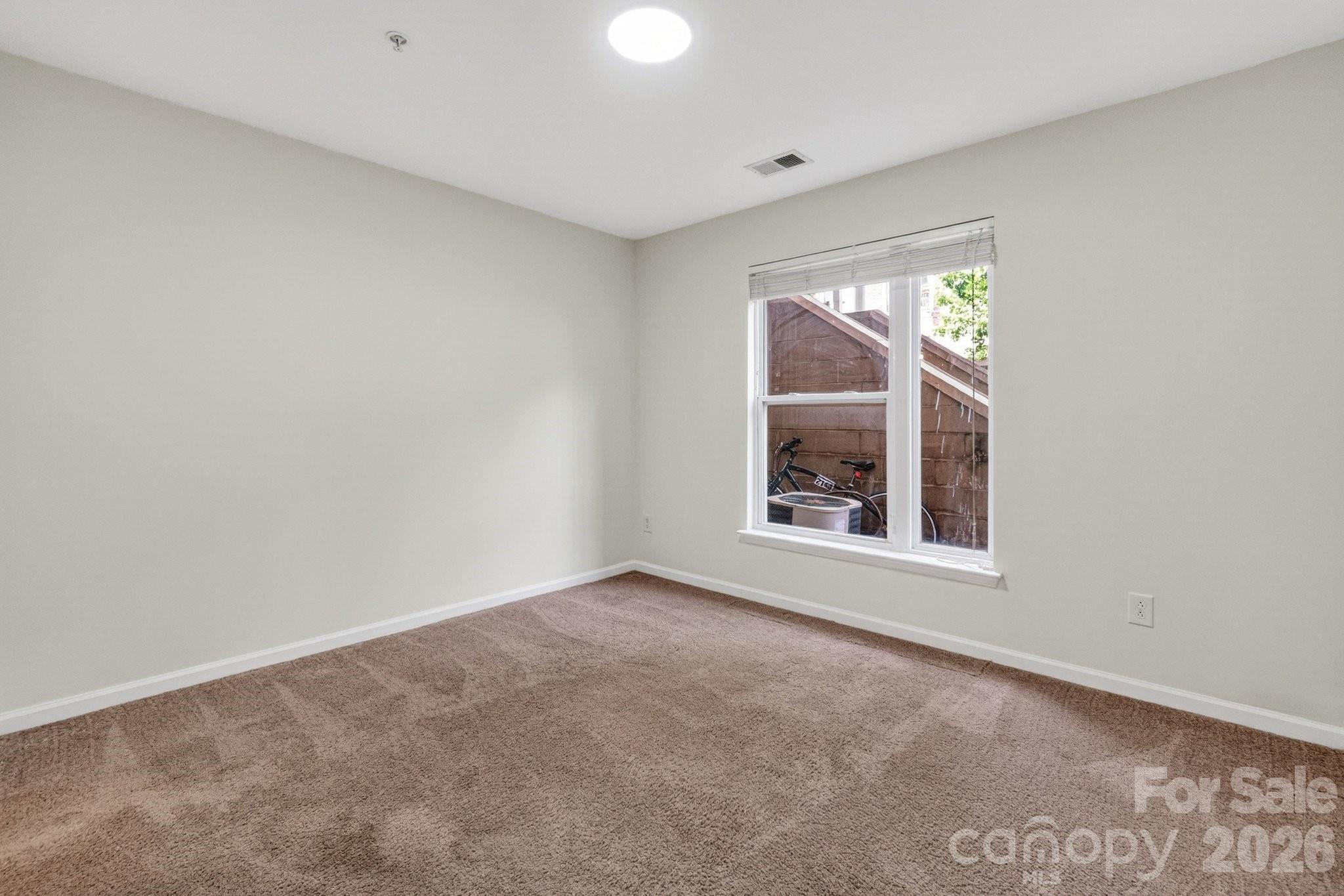 639 Raphael Place Charlotte, NC 28205 - Photo 22 of 36 an empty room with a window
