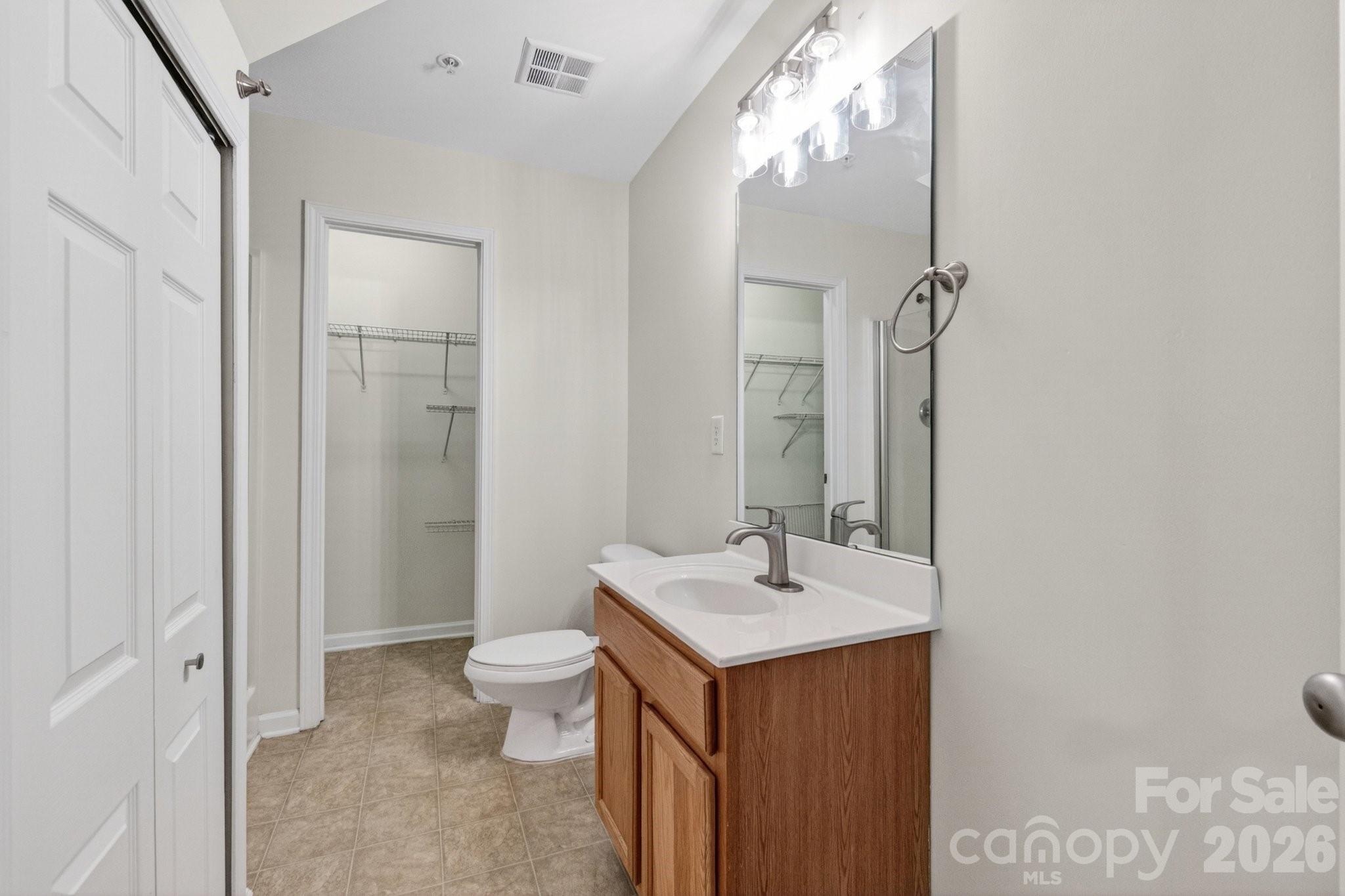 639 Raphael Place Charlotte, NC 28205 - Photo 25 of 36 a bathroom with a sink a toilet and shower