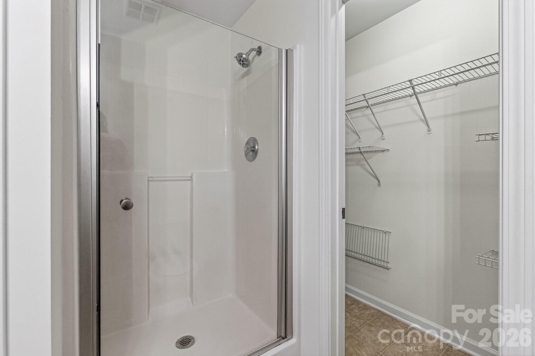 639 Raphael Place Charlotte, NC 28205 - Photo 26 of 36 a bathroom with a glass shower door