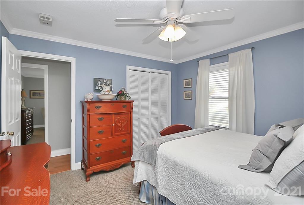 852 Union Church Road Lancaster, SC 29720 - Photo 22 of 44 a bedroom with a bed and dresser