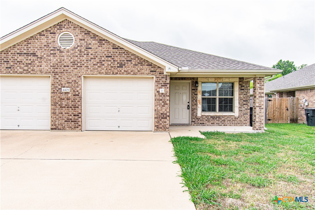 4409 Brutus Ln., Unit B Temple, TX 76502 - Photo 1 of 1 a front view of a house with a yard