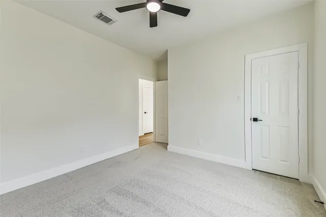 a bathroom with a toilet a sink a tub and mirror