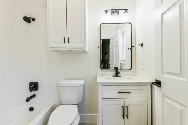 a view of a swimming pool with a bench in front of a building