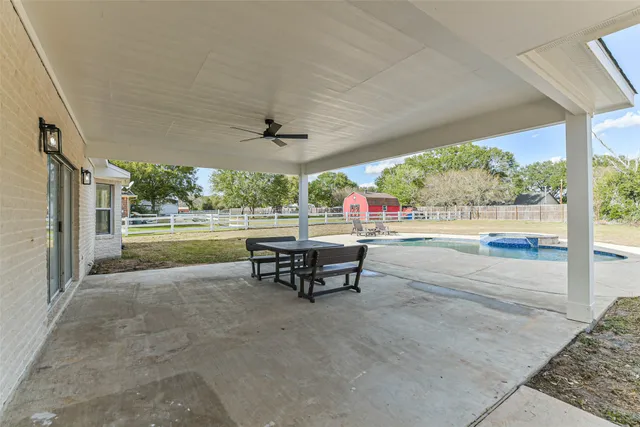 a view of a swimming pool with a yard