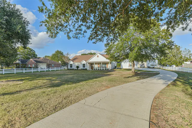 a view of swimming pool with outdoor space and trees around