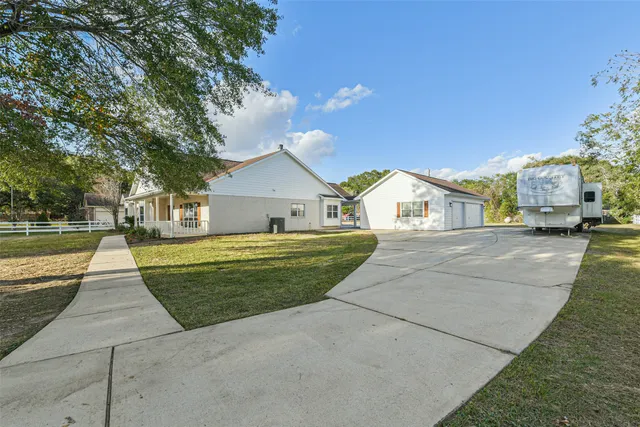 an aerial view of house with yard