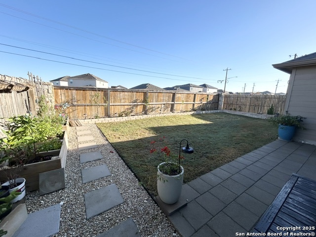 10127 Helios Heights Converse, TX 78109 - Photo 14 of 16 a view of a backyard with sitting area