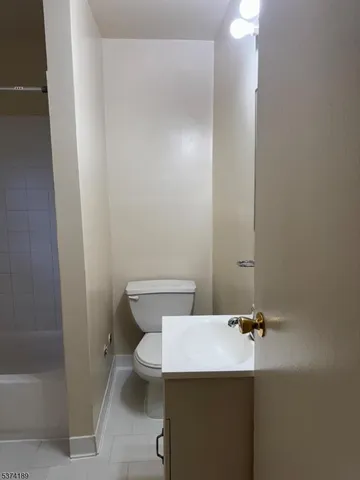 a bathroom with a toilet and a sink