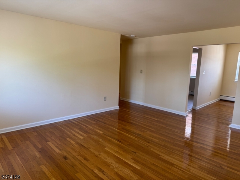 1298 Valley Road, Unit 1 Wayne, NJ 07470 - Photo 10 of 18 a view of an empty room with wooden floor