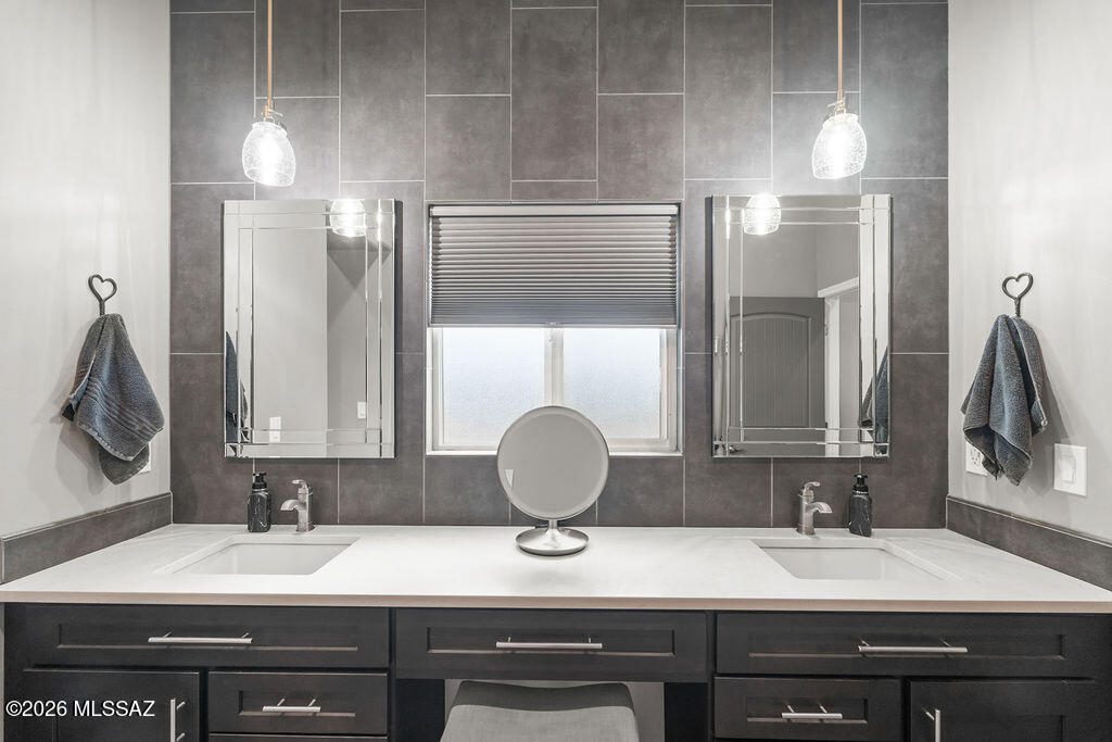 16276 East Empire View Road Vail, AZ 85641 - Photo 37 of 51 a bathroom with a sink and a mirror