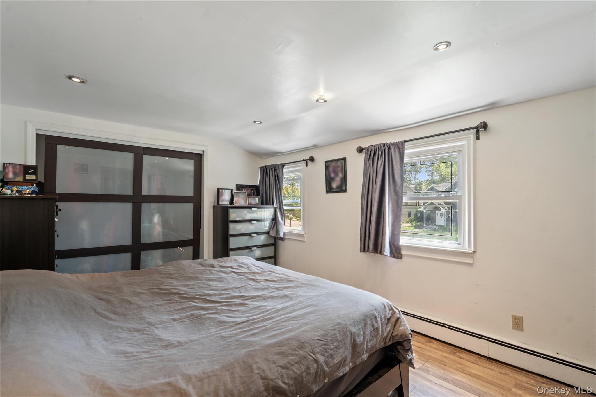 9 Rugby Road Massapequa, NY 11758 - Photo 15 of 33 a bedroom with a bed and a window