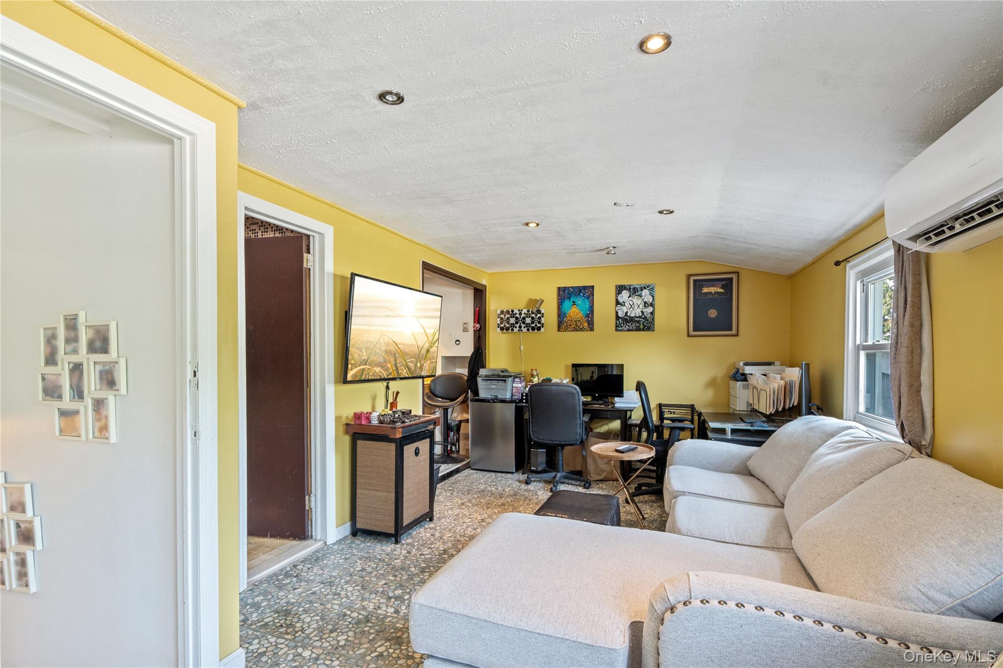 9 Rugby Road Massapequa, NY 11758 - Photo 18 of 33 a living room with furniture and a window