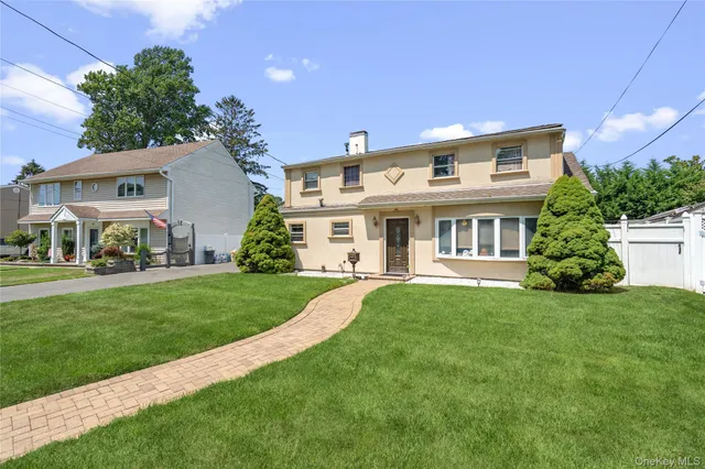 a view of a house with a yard porch and sitting area
