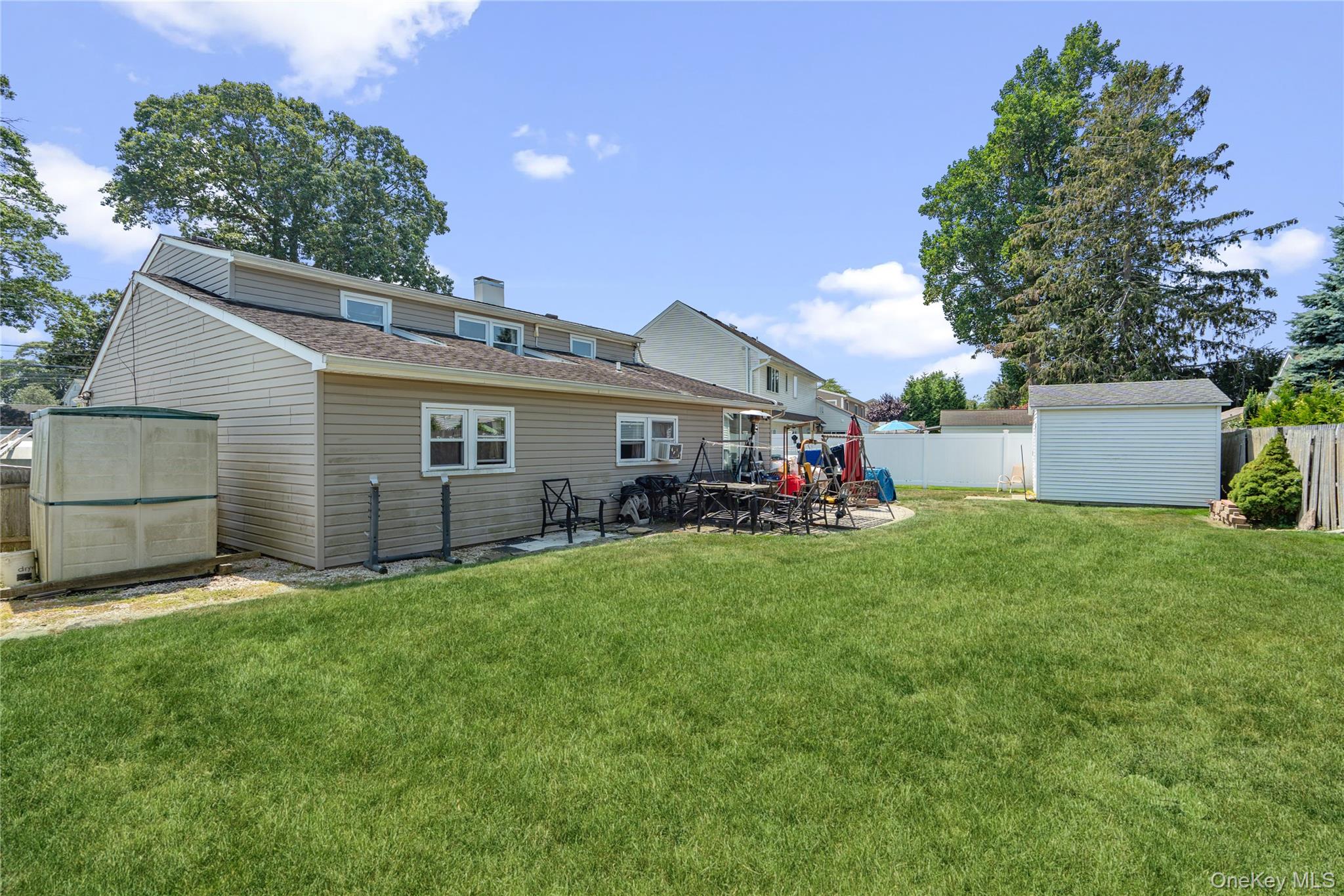 9 Rugby Road Massapequa, NY 11758 - Photo 24 of 33 a front view of house with yard and green space