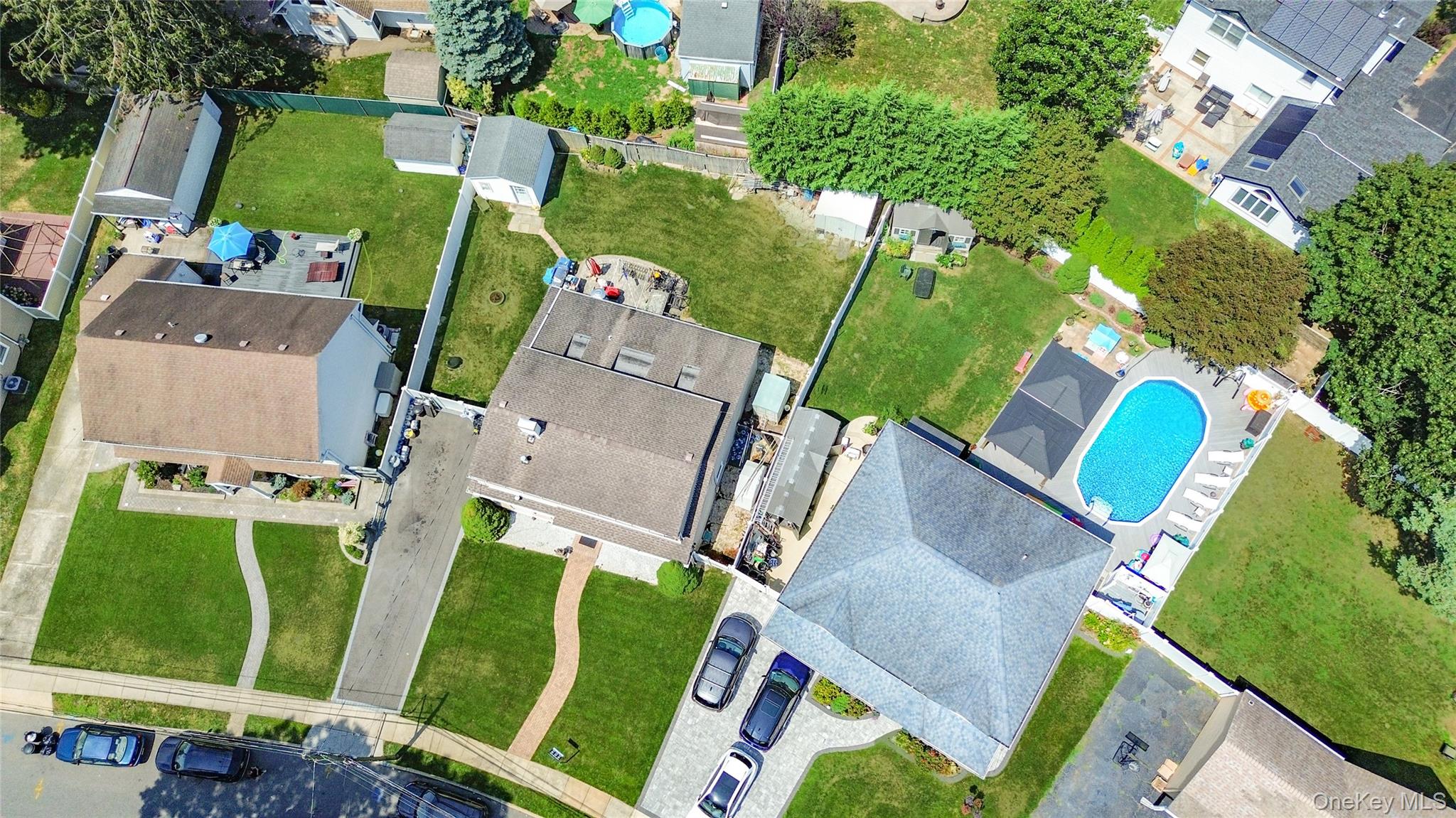 9 Rugby Road Massapequa, NY 11758 - Photo 27 of 33 an aerial view of a house with a yard and trees