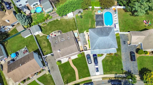 an aerial view of multiple houses with outdoor space