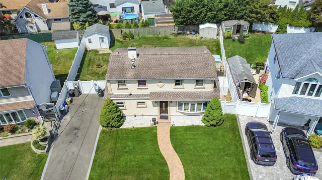 an aerial view of a house with outdoor space patio and trees