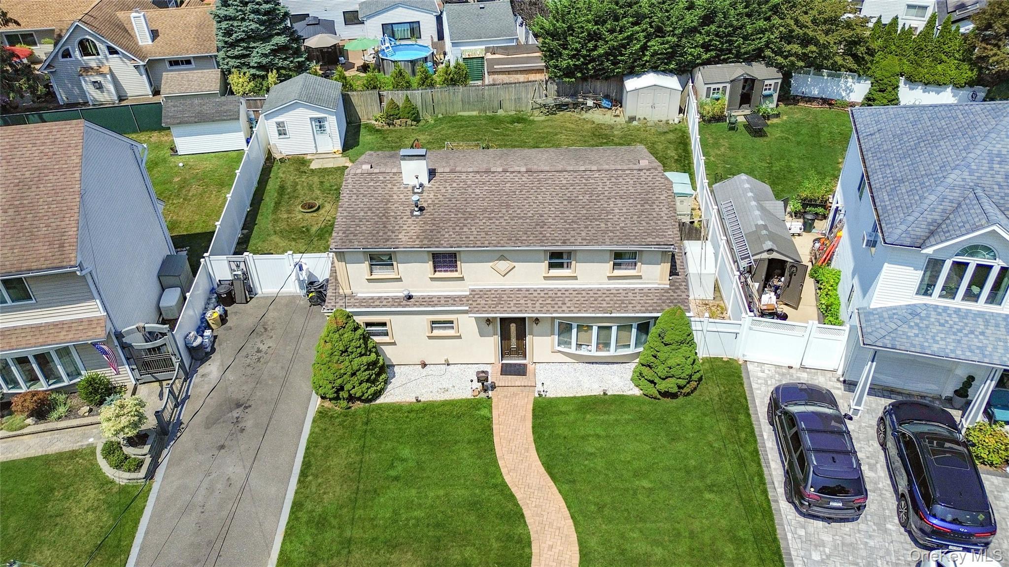 9 Rugby Road Massapequa, NY 11758 - Photo 30 of 33 an aerial view of a house with outdoor space patio and trees
