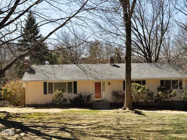 11 Hawthorne Hill Road Newtown, CT 06470 - Photo 1 of 1 a front view of a house with a yard covered with snow and trees