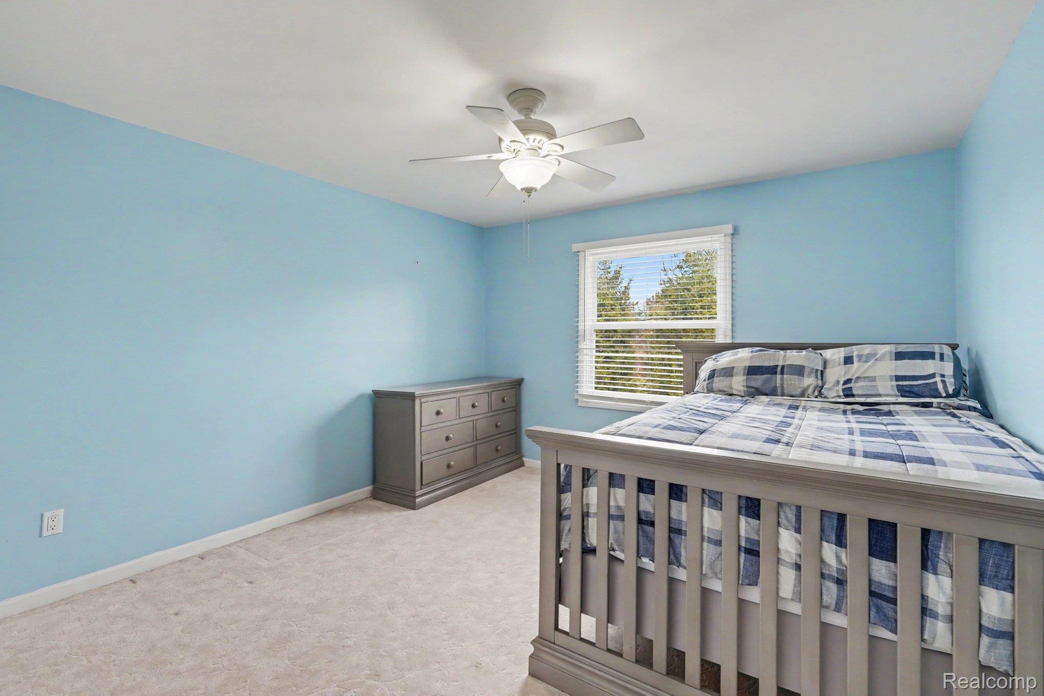 1941 Mapleridge Road Rochester, MI 48309 - Photo 32 of 55 Bedroom with light carpet and a ceiling fan