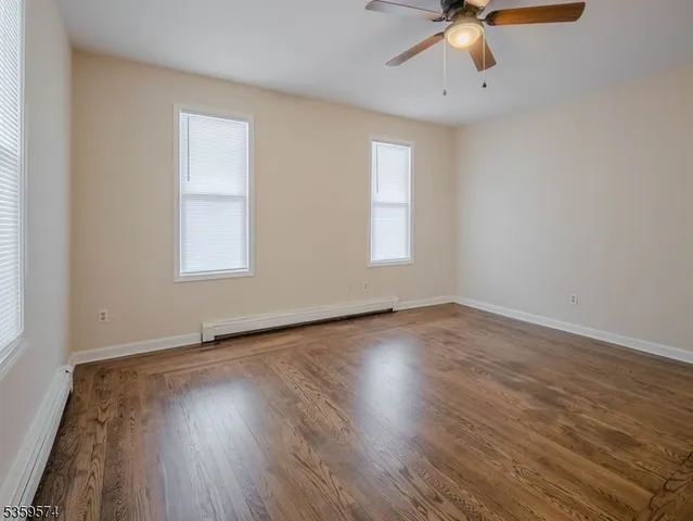 a kitchen with cabinets appliances and a window