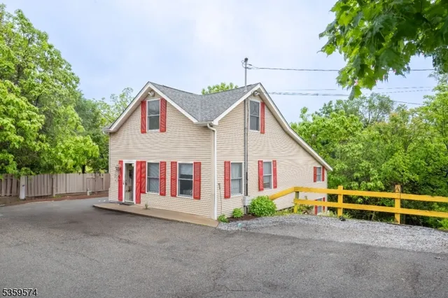 a view of front of house with a yard