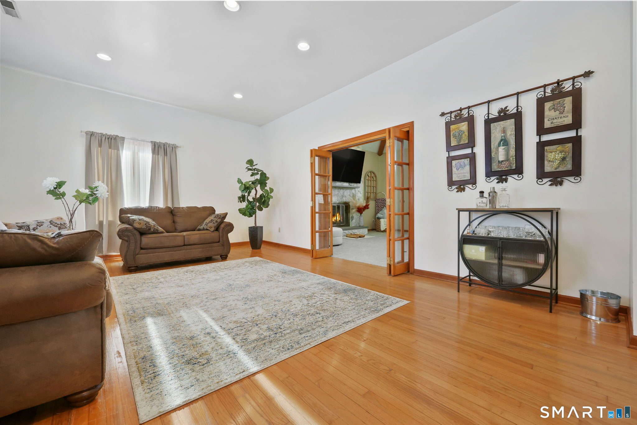 41 Ridge Line Road Easton, CT 06612 - Photo 17 of 40 a living room with furniture and a fireplace
