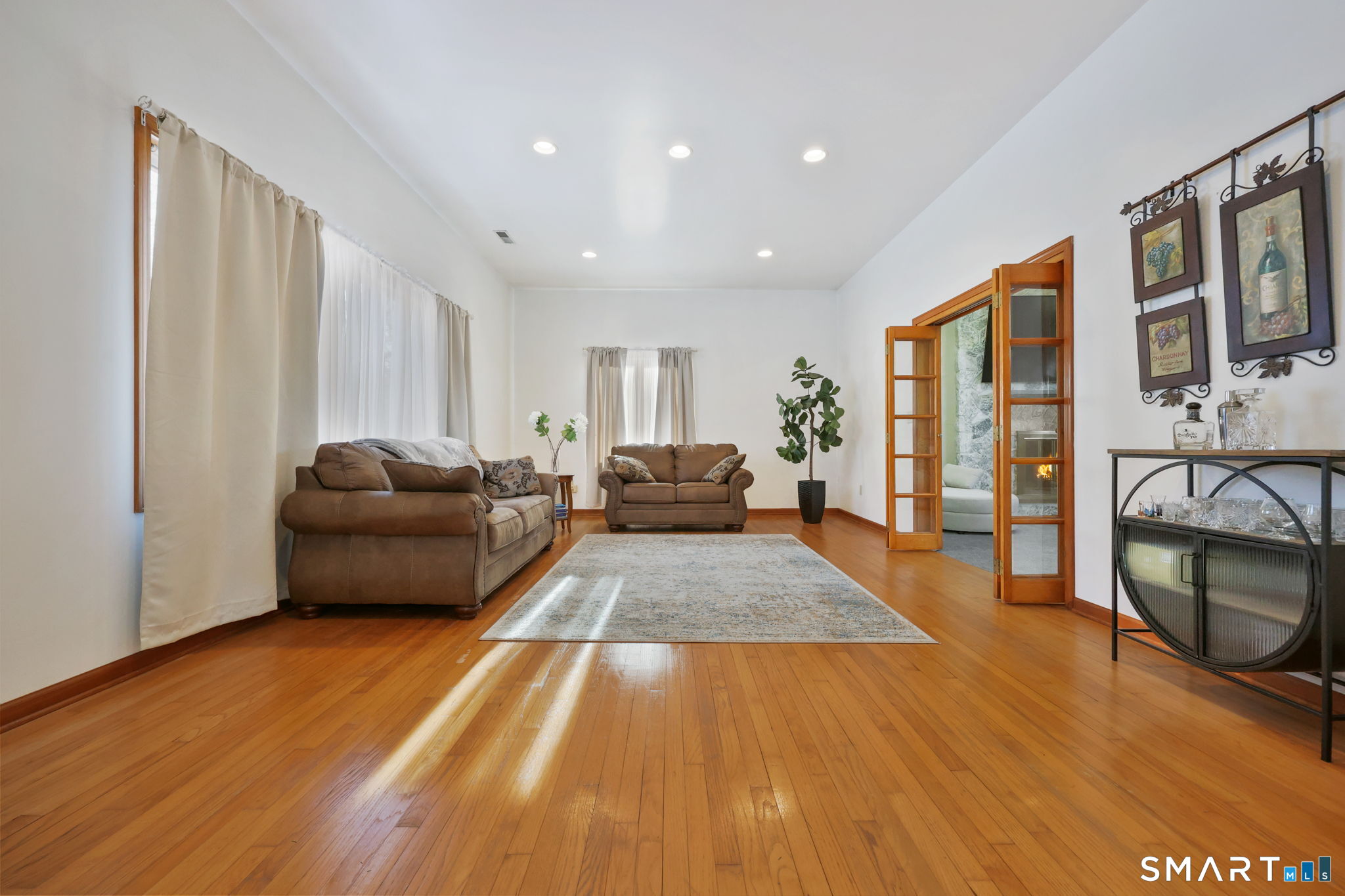 41 Ridge Line Road Easton, CT 06612 - Photo 18 of 40 a living room with furniture and a wooden floor