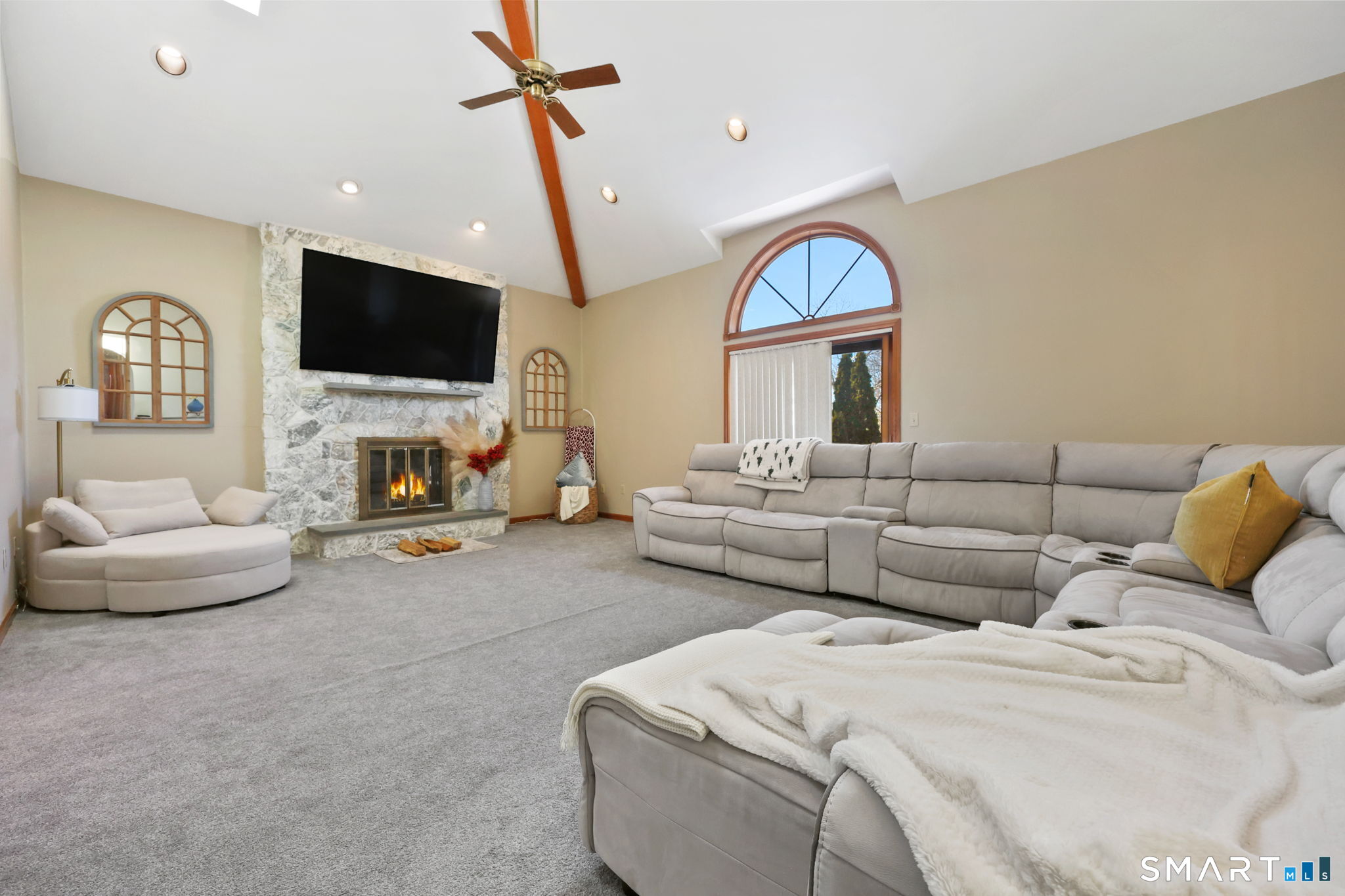 41 Ridge Line Road Easton, CT 06612 - Photo 19 of 40 a living room with furniture a fireplace and a flat screen tv
