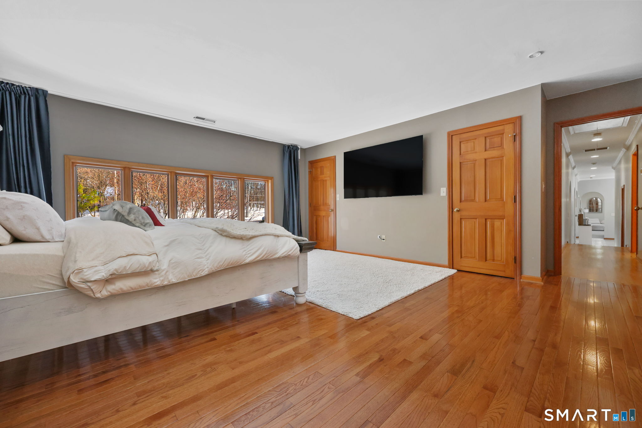 41 Ridge Line Road Easton, CT 06612 - Photo 24 of 40 a spacious bedroom with a bed and a flat screen tv