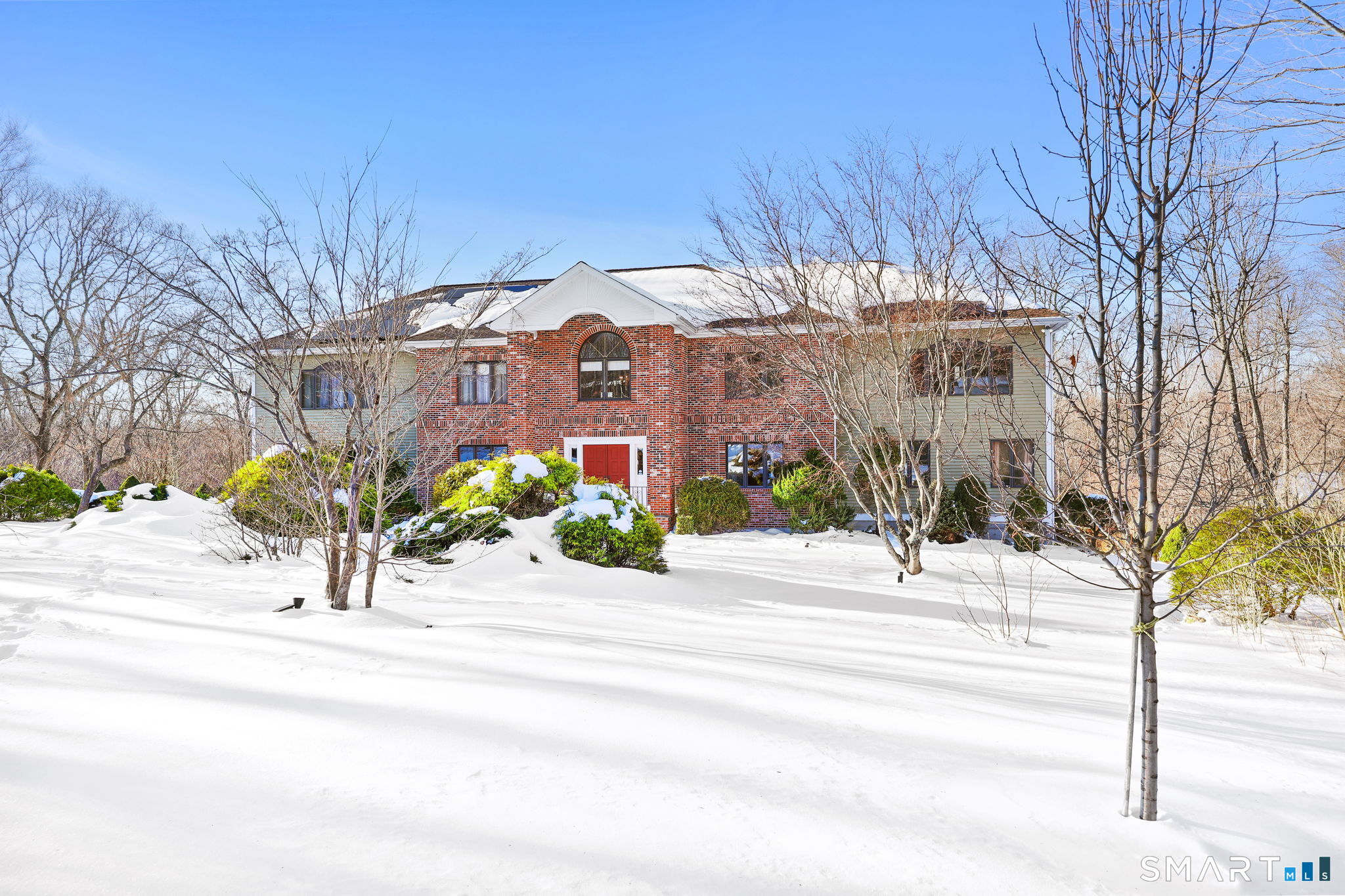 41 Ridge Line Road Easton, CT 06612 - Photo 4 of 40 a view of a garden with a building in the background