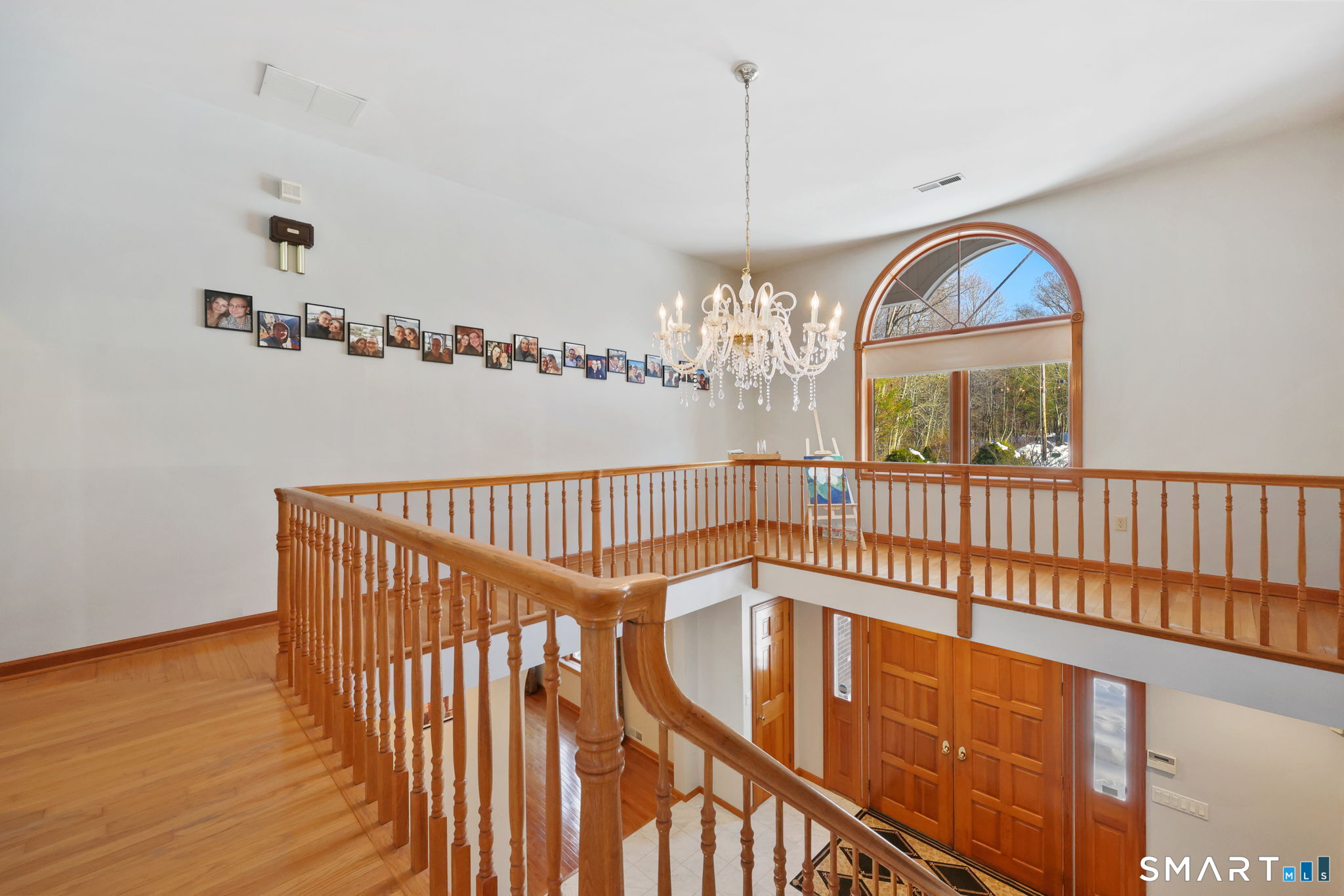 41 Ridge Line Road Easton, CT 06612 - Photo 10 of 40 a view of a livingroom with wooden floor and staircase