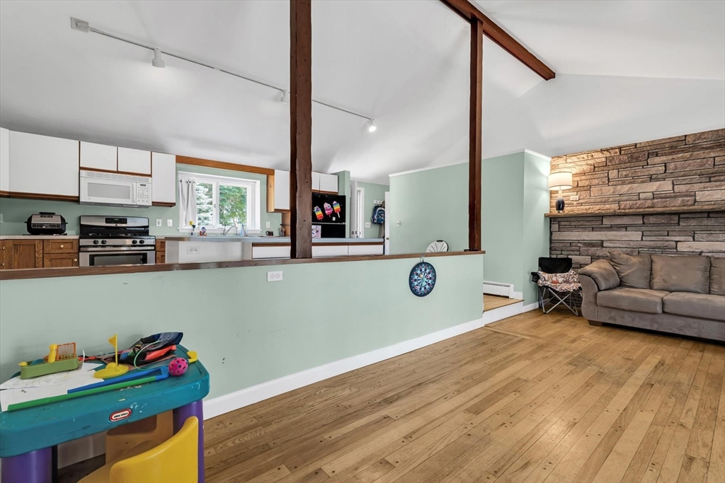 9 Point Road Mashpee, MA 02649 - Photo 13 of 27 a room with furniture and a wooden floor