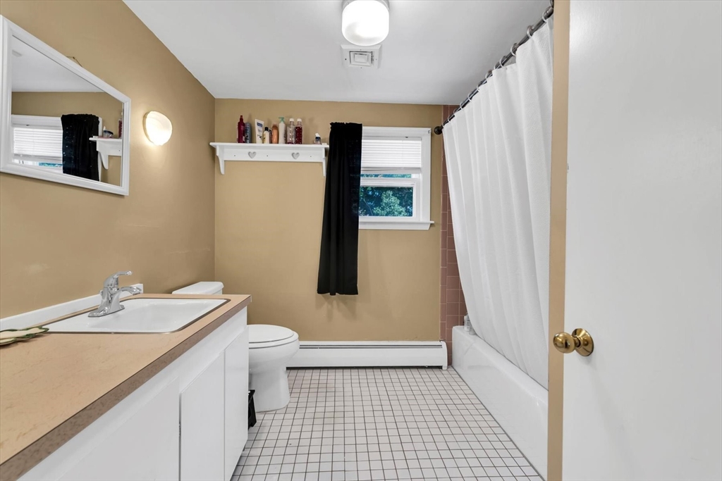 9 Point Road Mashpee, MA 02649 - Photo 21 of 27 a bathroom with a sink a toilet and shower