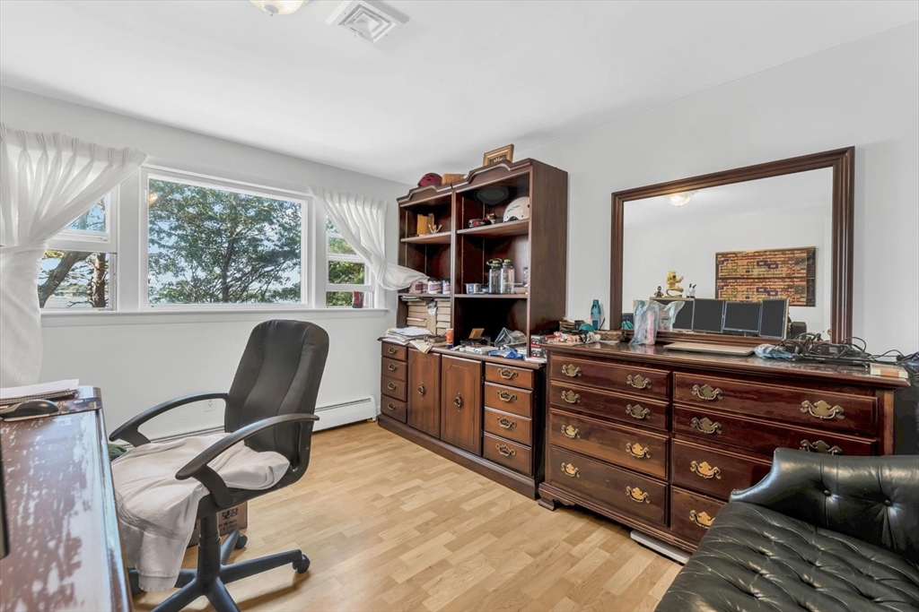 9 Point Road Mashpee, MA 02649 - Photo 23 of 27 a room with a chair and a large window