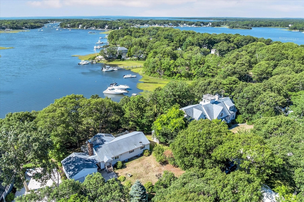 9 Point Road Mashpee, MA 02649 - Photo 3 of 27 an aerial view of a house with a yard