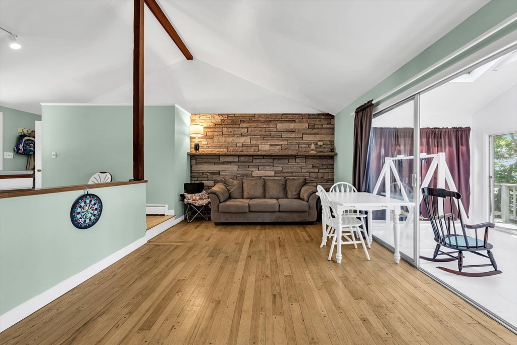 9 Point Road Mashpee, MA 02649 - Photo 7 of 27 a living room with furniture and a wooden floor