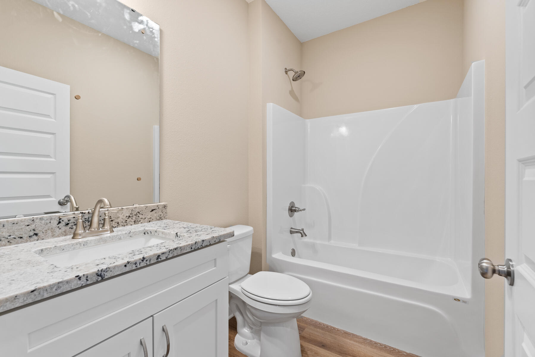 6011 Sand Hill Road Crestview, FL 32539 - Photo 14 of 16 a bathroom with a granite countertop sink toilet and shower