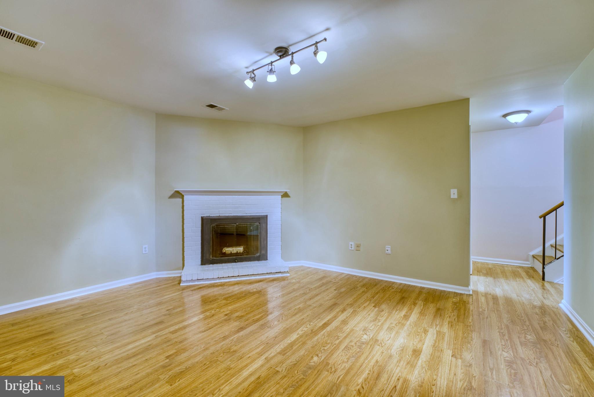 11719 Dry River Court Reston, VA 20191 - Photo 34 of 44 Lower Level Family Room w/fireplace