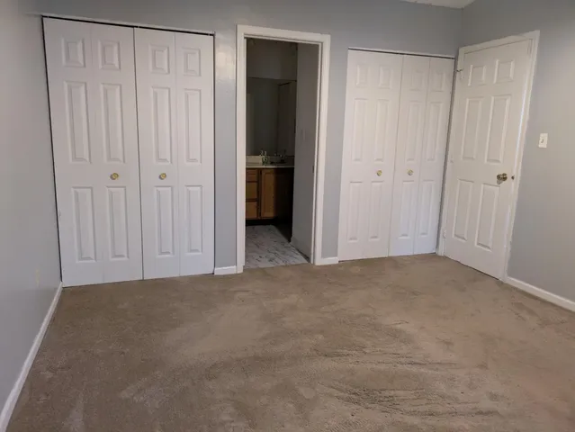 a view of an empty room with entryway